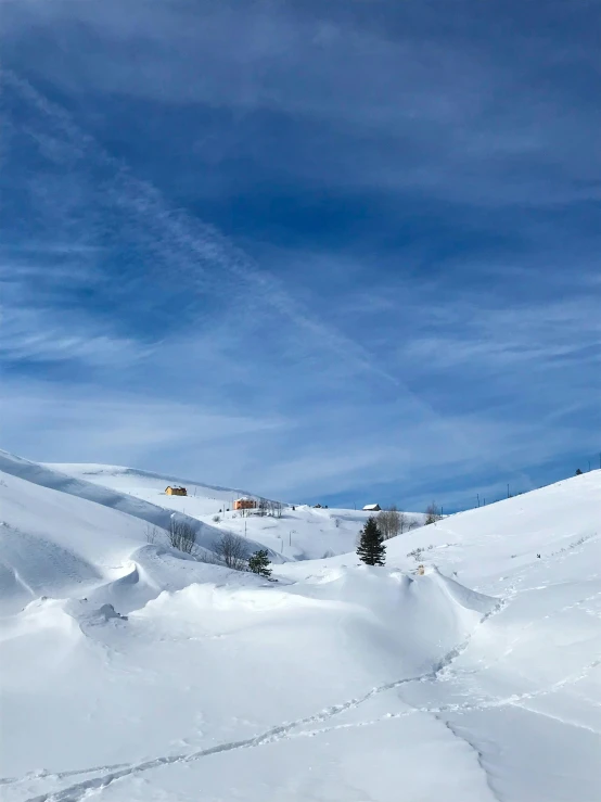 a man riding skis down a snow covered slope, by Matthias Weischer, pexels contest winner, les nabis, small cottage in the foreground, panoramic, prize winning color photo, snowy apennines