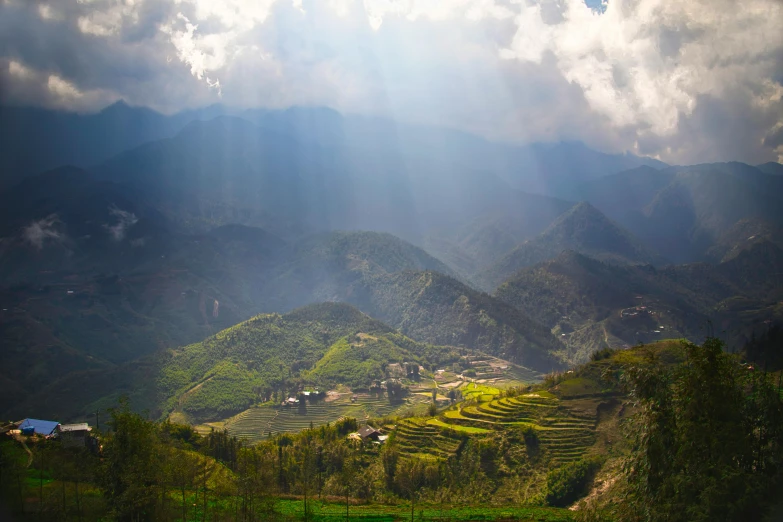 the sun shines through the clouds over a valley, pexels contest winner, sumatraism, vietnam, profile image, multiple stories, spring light