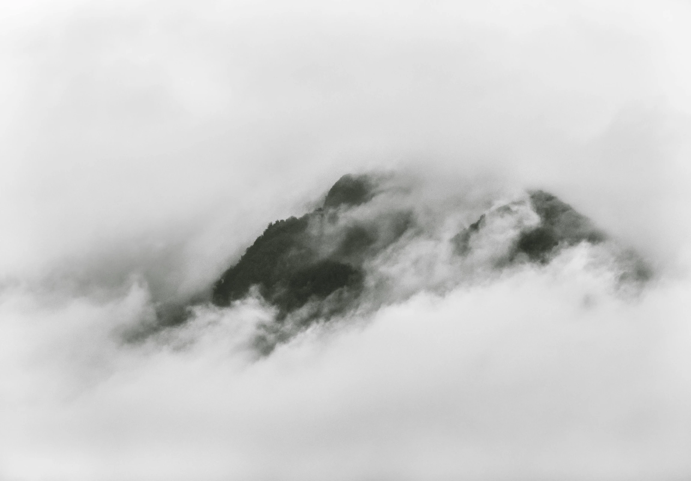 a black and white photo of a mountain in the clouds, a black and white photo, pexels contest winner, minimalism, white fog painting, slightly pixelated, white cloud, high angle view