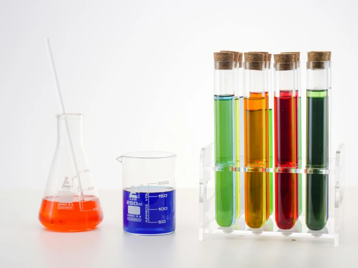 a row of test tubes filled with colored liquids, unsplash, fan favorite, clean white lab background, scales with magic powder, product display photograph