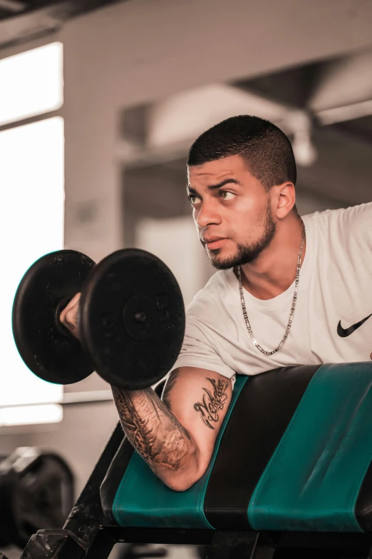 a man lifting a barbell in a gym, a colorized photo, pexels contest winner, zayn malik, riyahd cassiem, headshot, gal yosef