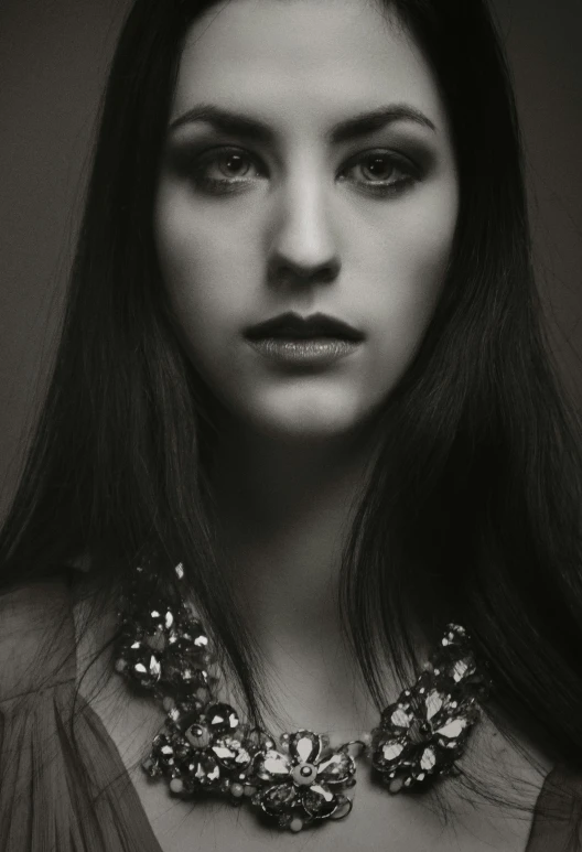 a black and white photo of a woman with long hair, a black and white photo, inspired by Dora Maar, color studio portrait, black-hair pretty face, kailee mandel, medium close up portrait