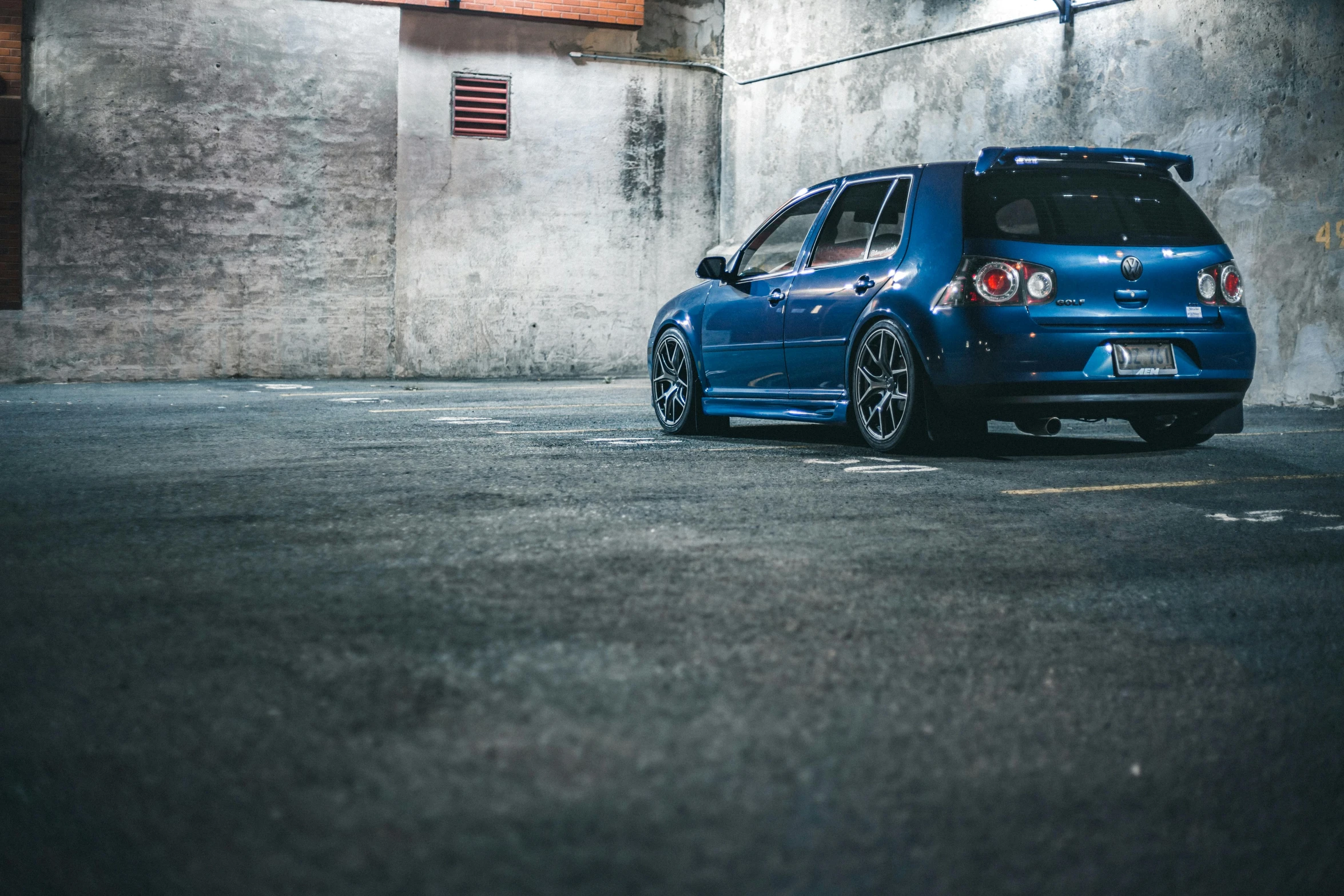 a blue car parked in a parking lot, unsplash, avatar image, samurai vinyl wrap, indoor picture, fullbody photo