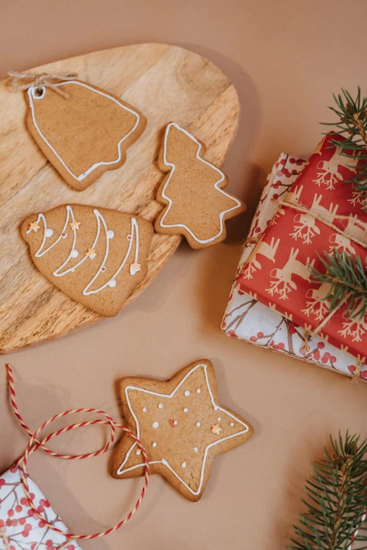 a couple of cookies sitting on top of a wooden cutting board, by Lucette Barker, organic ornaments, thumbnail, wrapped, multiple stories