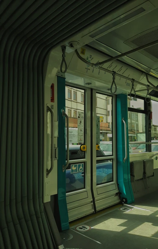 a view of the inside of a subway car, a detailed matte painting, inspired by Jean Béraud, unsplash, white and teal metallic accents, trams ) ) ), panorama view, square