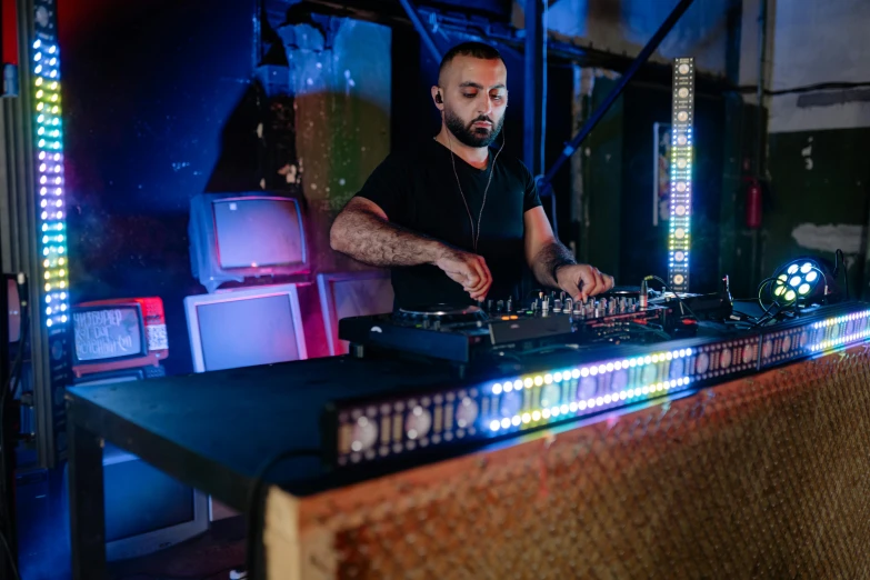 a man that is standing in front of a table, dj set, farid ghanbari, william warehouse, profile image