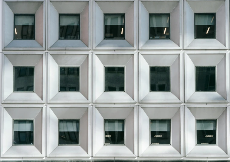 a close up of a building with many windows, inspired by David Chipperfield, unsplash, square facial structure, white steel, window, viewed from bellow