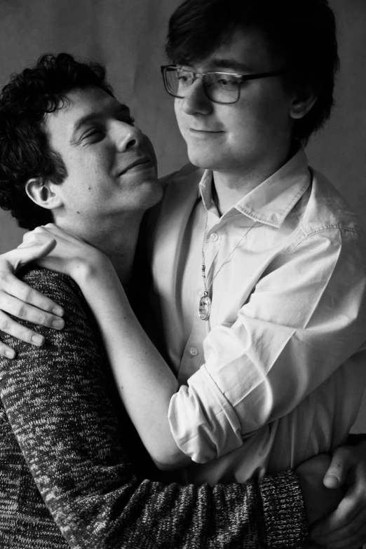 a black and white photo of a man hugging a woman, a black and white photo, by Felix-Kelly, bradley james and colin morgan, homestuck, 15081959 21121991 01012000 4k, two young men