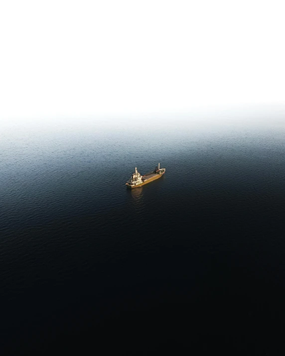 a boat floating in the middle of a large body of water, by Sebastian Spreng, pexels contest winner, minimalism, oil spill, utilitarian cargo ship, gif, looking towards camera