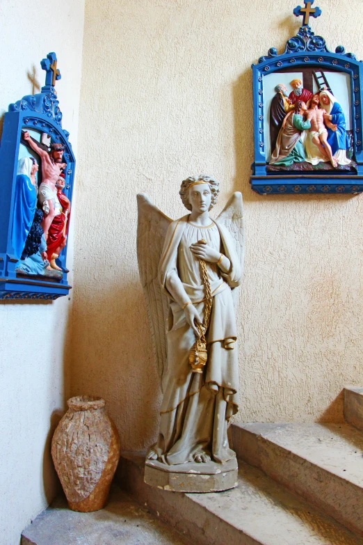 a statue sitting on top of a set of stairs, a statue, by Andrea del Verrocchio, renaissance, archangel, sedlec ossuary, an angel standing still, blue