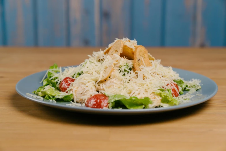 a close up of a plate of food on a table, caesar, thumbnail, medium blonde, caparisons