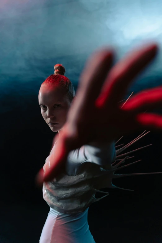 a woman in a white dress holding a tennis racquet, an album cover, inspired by Brooke Shaden, unsplash contest winner, in a underwater horror scene, her hands are red roots, takato yomamoto. 4 k, portrait of combat dancer