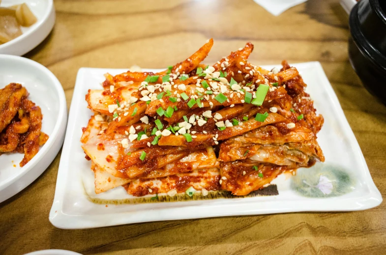 a close up of a plate of food on a table, mingei, spicy, stacked image, taejune kim, best fries