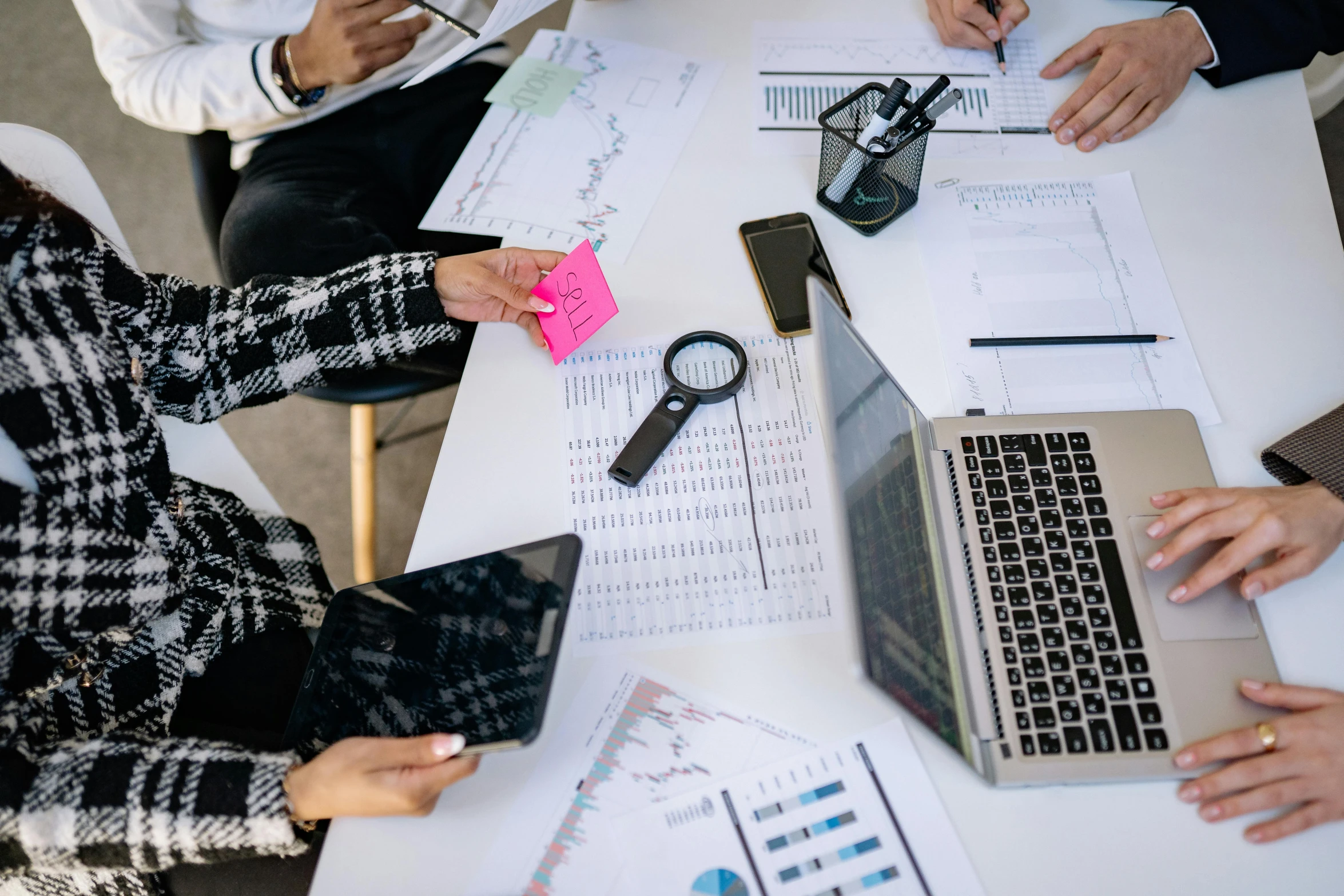 a group of people sitting around a table with laptops, trending on pexels, analytical art, engineering, excel running on the computer, thumbnail, sales