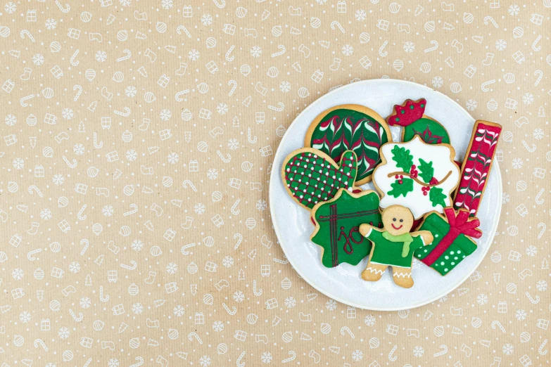 a plate that has some cookies on it, inspired by Ernest William Christmas, pixabay, naive art, background image, paper cut out, green and warm theme, wallpaper!