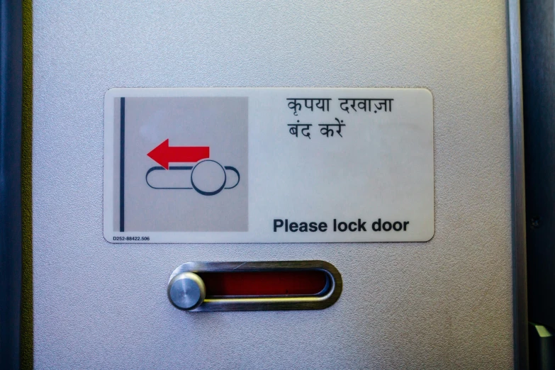 a close up of a sign on a door, by Odhise Paskali, flickr, private press, inside airplane, switches, hindi text, lock