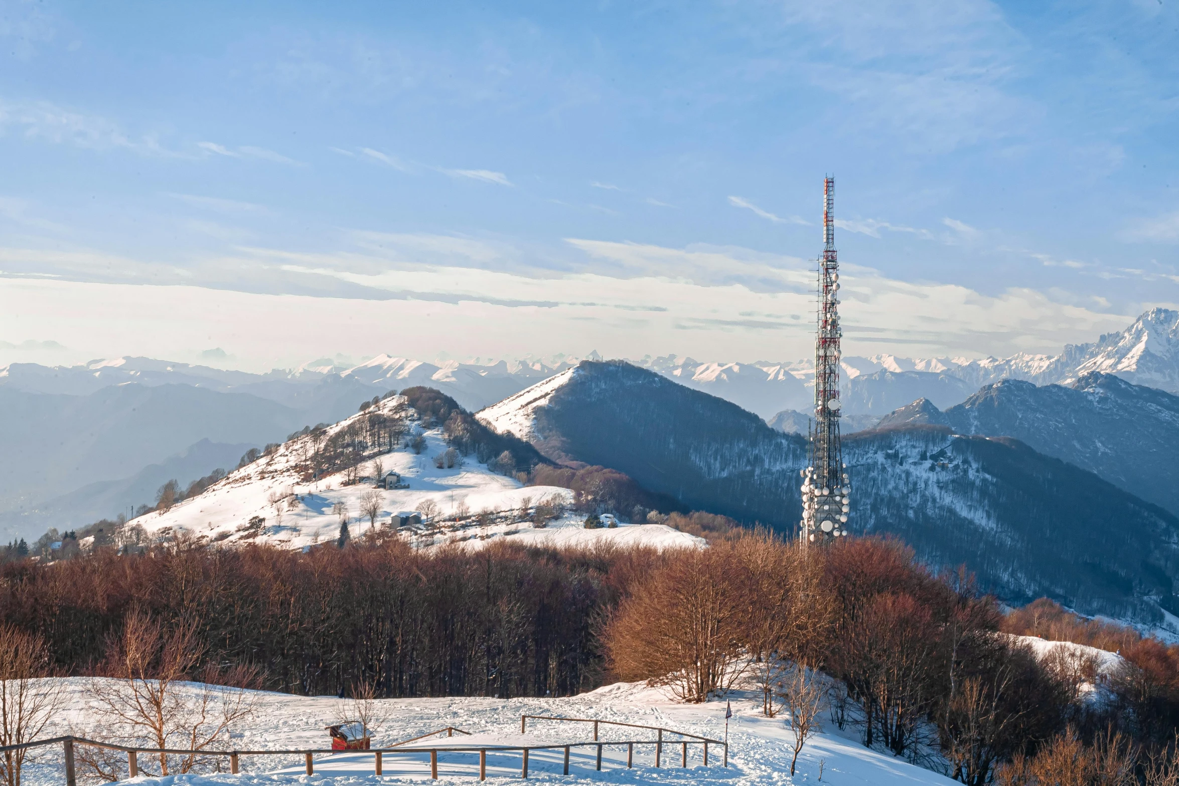 a man riding skis down a snow covered slope, by Cedric Peyravernay, pexels contest winner, les nabis, lookout tower, antennas, (3 are winter, abbondio stazio