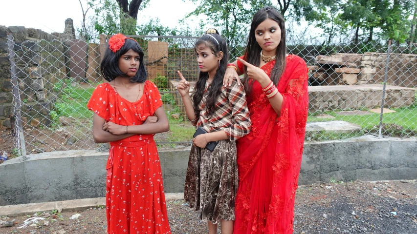 a group of young women standing next to each other, samikshavad, threatening pose, transgender, on set, square