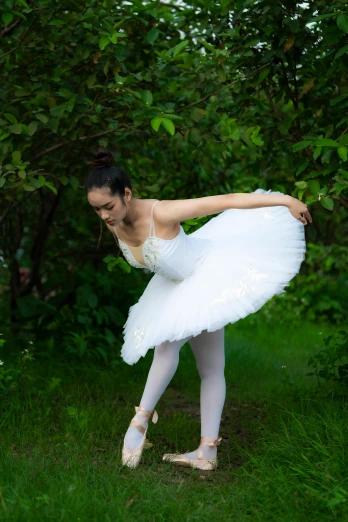 a woman that is standing in the grass, by Elizabeth Polunin, unsplash, arabesque, dressed as a ballerina, square, 15081959 21121991 01012000 4k, wearing white skirt
