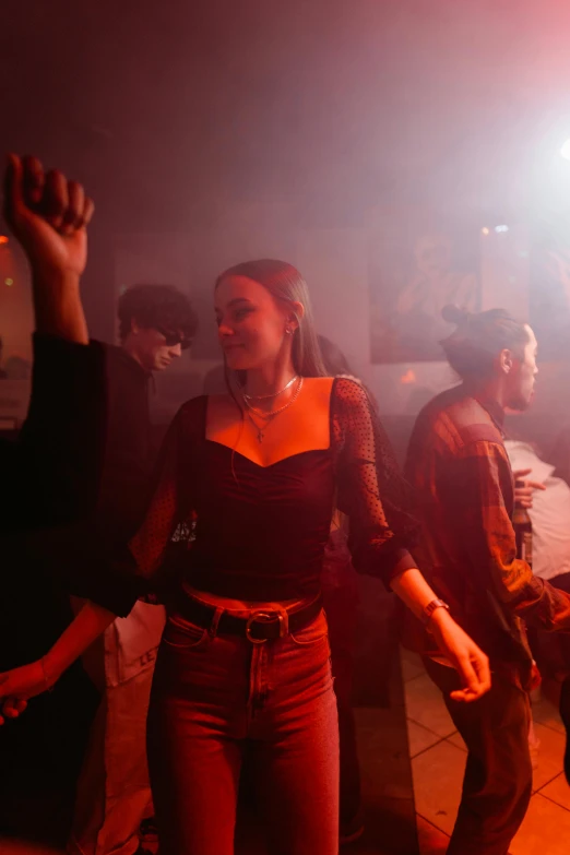 a group of people standing on top of a street, an album cover, inspired by Nan Goldin, trending on pexels, renaissance, nightclub dancing inspired, smoke fills the room, dj at a party, photo of young woman