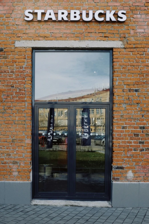 a red fire hydrant sitting in front of a brick building, inspired by Władysław Czachórski, hyperrealism, reflected in giant mirror, metal framed portal, neo norilsk, window ( city )