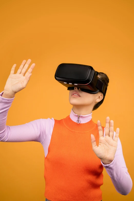 a woman wearing a virtual reality headset, by Carey Morris, shutterstock, hypermodernism, in front of an orange background, gesture dynamic, square, y2k