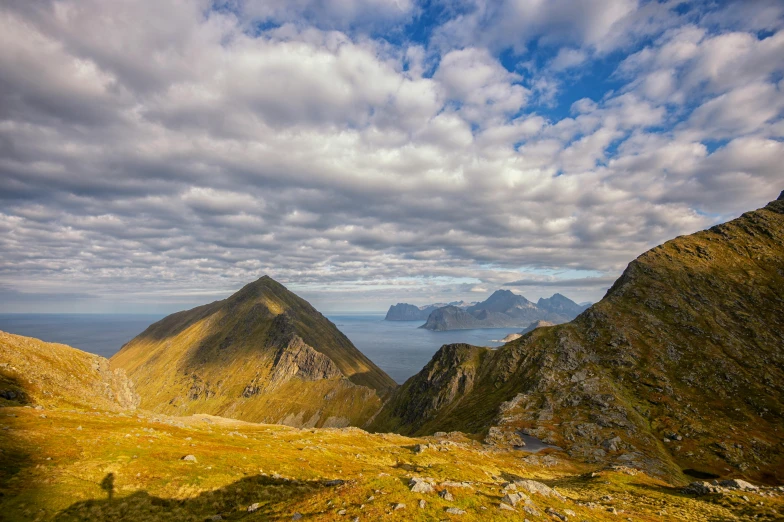 a view of the mountains from the top of a hill, by Harald Giersing, pexels contest winner, hurufiyya, coastal, avatar image, thumbnail, 8k octan photo