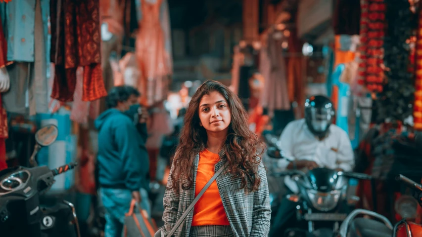 a woman standing in the middle of a crowded street, pexels contest winner, hyperrealism, young himalayan woman, avatar image, confident looking, good lighted photo