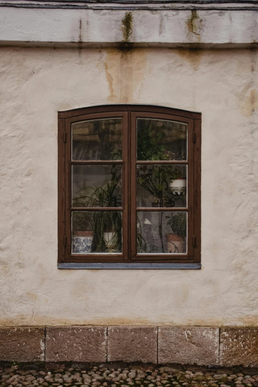 a red fire hydrant sitting in front of a white building, inspired by Camille Corot, renaissance, view through window, light - brown wall, black and terracotta, small windows