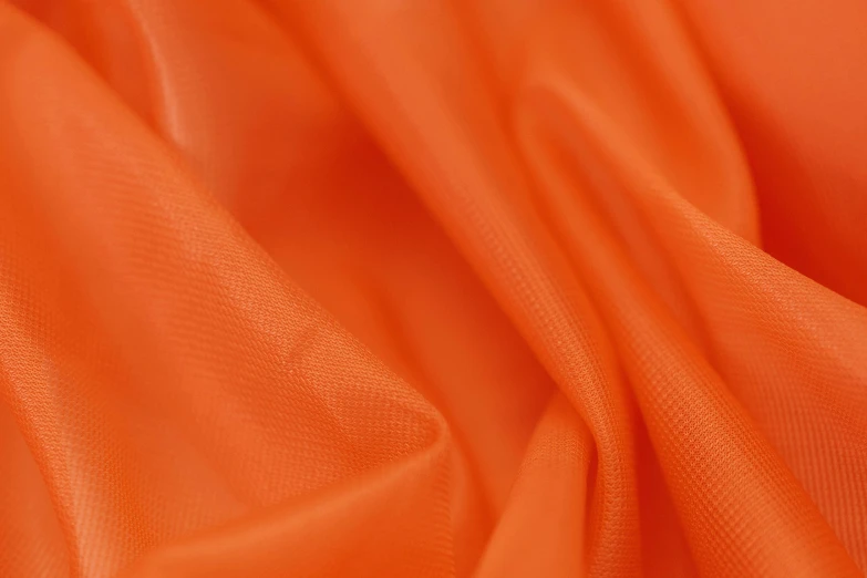 a close up shot of an orange fabric, inspired by Christo, unsplash, 8 k 4 k, translucent, low - angle shot, orange: 0.5