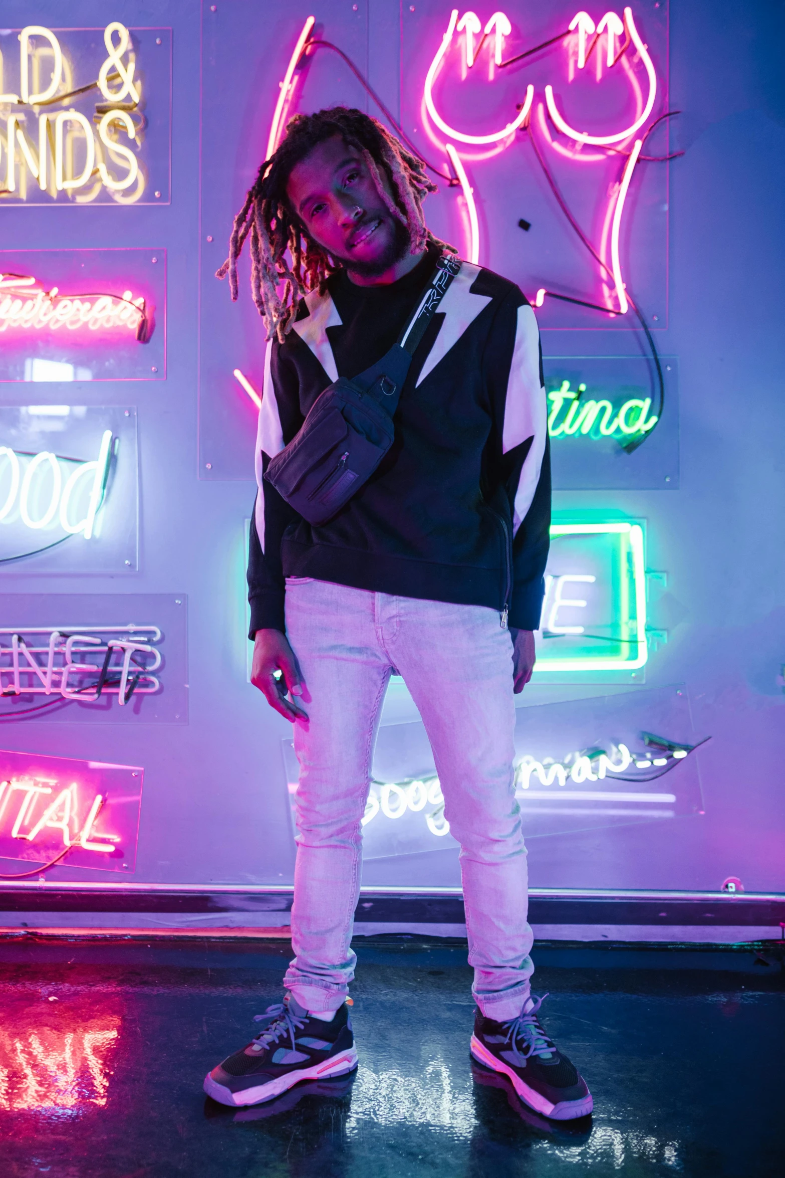 a man standing in front of neon signs, an album cover, trending on pexels, dreads, full body model, white neon lighting, dolman