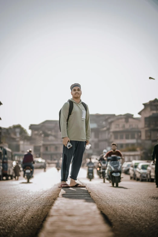 a man standing on a skateboard in the middle of a street, inspired by Steve McCurry, nepal, proud looking, student, avatar image