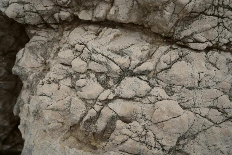 a close up of a rock with cracks in it, figuration libre, 4 k texture pack, hi - res textures, calanque, ((rocks))
