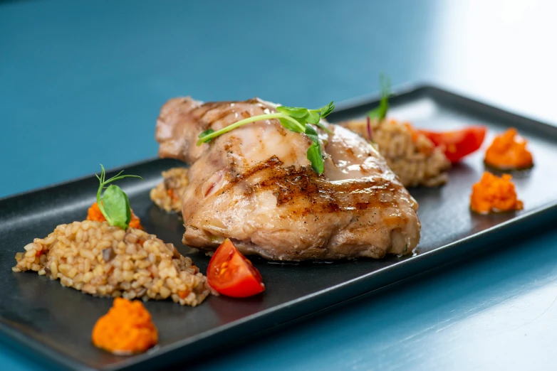 a close up of a plate of food on a table, brown tail, grilled chicken, profile image, thumbnail