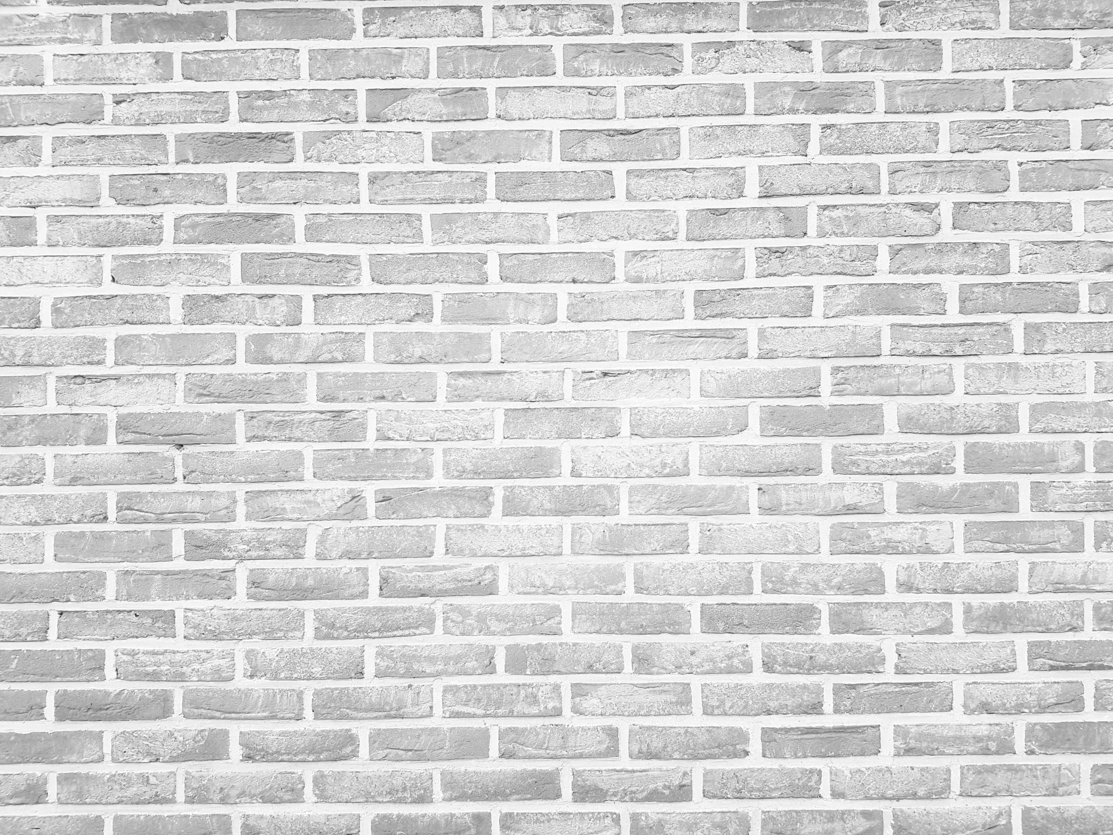 a black and white photo of a brick wall, a black and white photo, pexels, minimalism, background image, clean white lab background, celebration, set photo