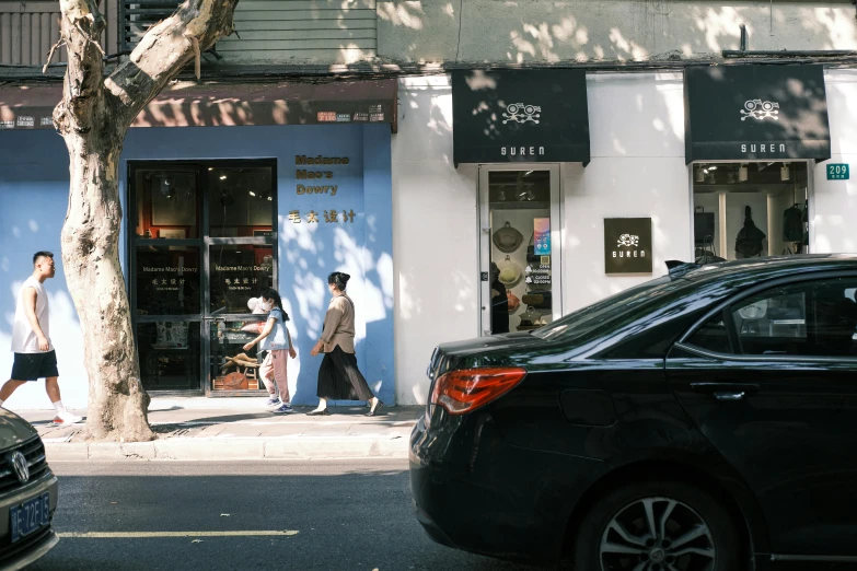 a couple of cars that are parked in front of a building, pexels contest winner, ashcan school, exiting store, people walking down a street, jackie tsai style, bakery