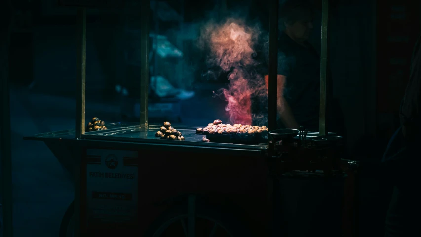 a person cooking food on a grill in the dark, a tilt shift photo, inspired by Elsa Bleda, pexels contest winner, hyperrealism, steamed buns, kebab, neon fog, middle eastern style vendors