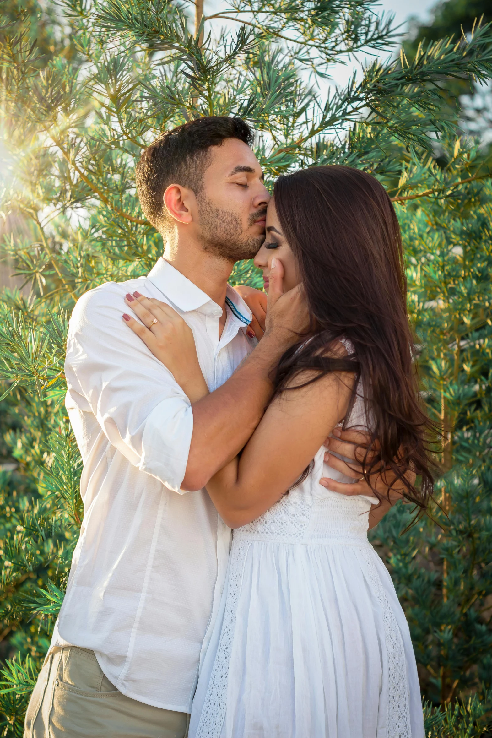 a man and a woman standing next to each other, pexels contest winner, renaissance, wearing a white sundress, making out, date trees, handsome man