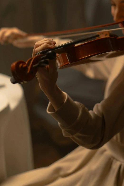 a woman in a white dress playing a violin, an album cover, by David Simpson, unsplash, closeup at the food, performing, [ cinematic, paul barson