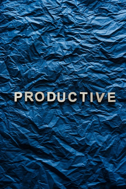 a blue crumpled paper with the word productive written on it, an album cover, by Adam Pijnacker, trending on unsplash, constructivism, navy, industries, sleep, pentagon