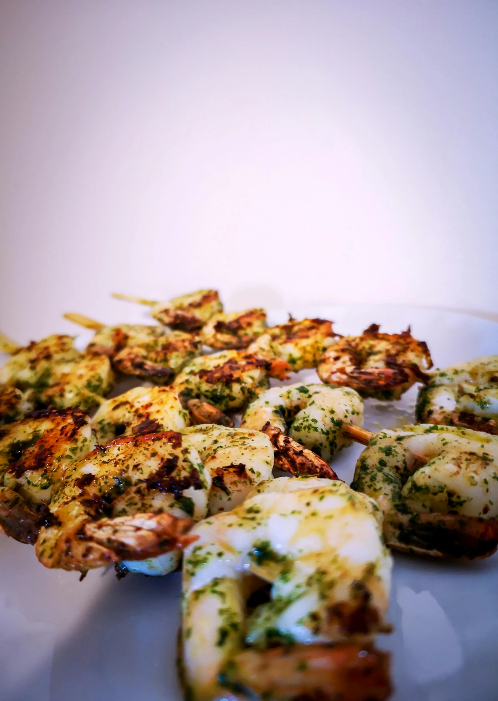 a close up of a plate of food on a table, front and side view, skewer, 6 pack, squids