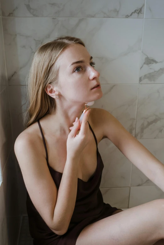 a woman sitting on a toilet in a bathroom, inspired by Elsa Bleda, trending on pexels, renaissance, chiseled jawline, silicone skin, grey, brown