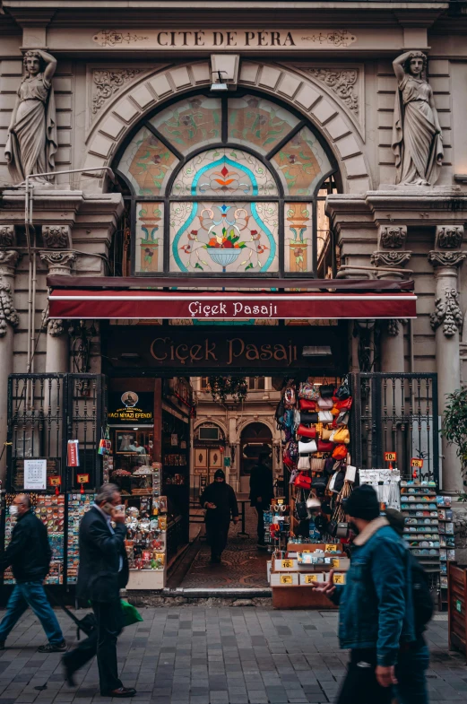 a group of people walking in front of a building, a picture, pexels contest winner, art nouveau, middle eastern style vendors, istanbul, convenience store, inside a grand