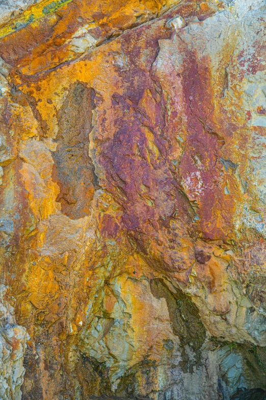 a rock that has some paint on it, by Rudolf Schlichter, unsplash, lyrical abstraction, layers of strata, “ iron bark, rusty colors, july 2 0 1 1