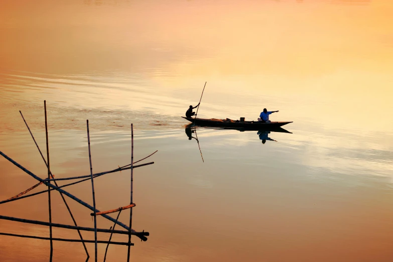 two people in a small boat on a body of water, by Eglon van der Neer, pexels contest winner, cambodia, soft glow, fishing, frans lanting