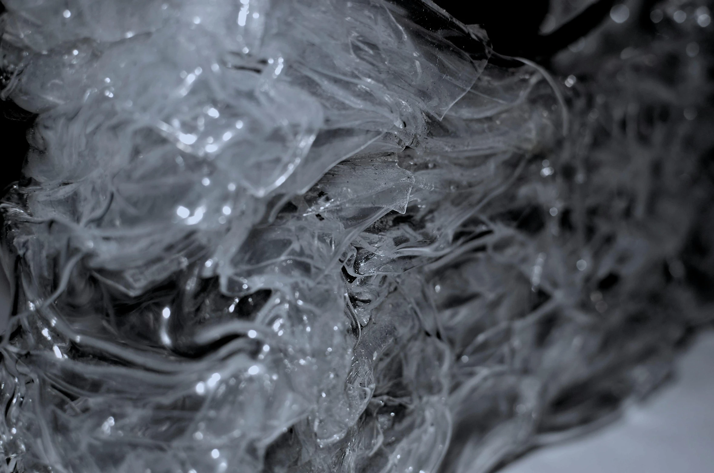 a piece of plastic sitting on top of a counter, an abstract sculpture, unsplash, plasticien, detailed smoke, detailed entangled fibres, vinyl material, water paint