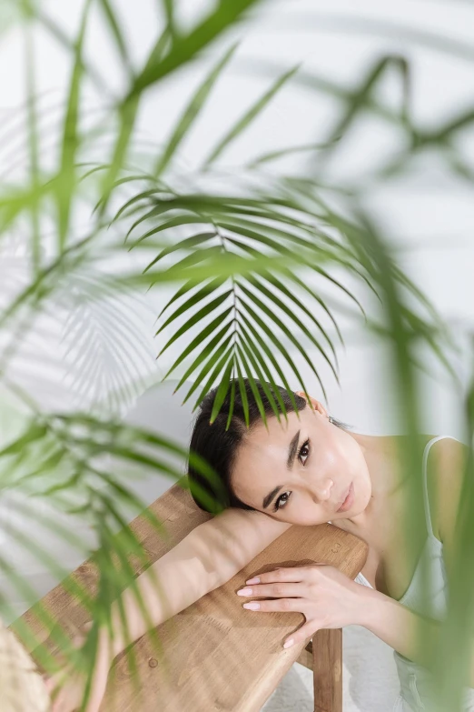 a woman in a bathtub surrounded by plants, a portrait, trending on pexels, made of bamboo, relaxing on the couch, beauty portrait, palm skin