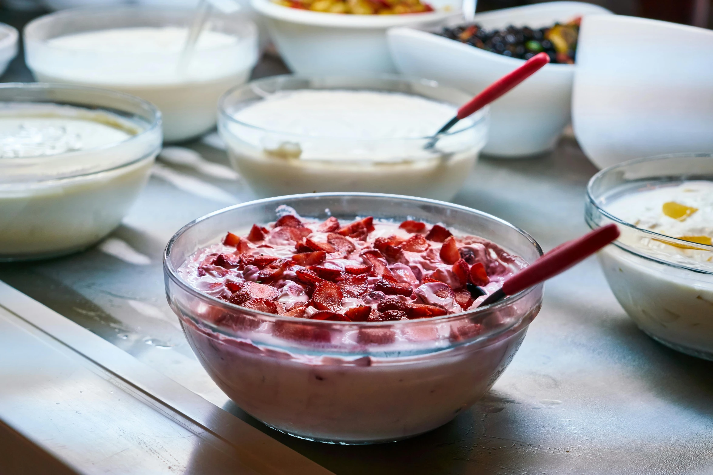 a table topped with bowls and bowls of food, strawberry ice cream, breakfast buffet, profile image, local foods