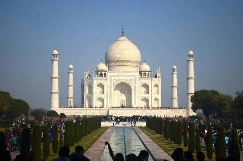 a group of people standing in front of a building, a marble sculpture, taj mahal, from the distance, square, image