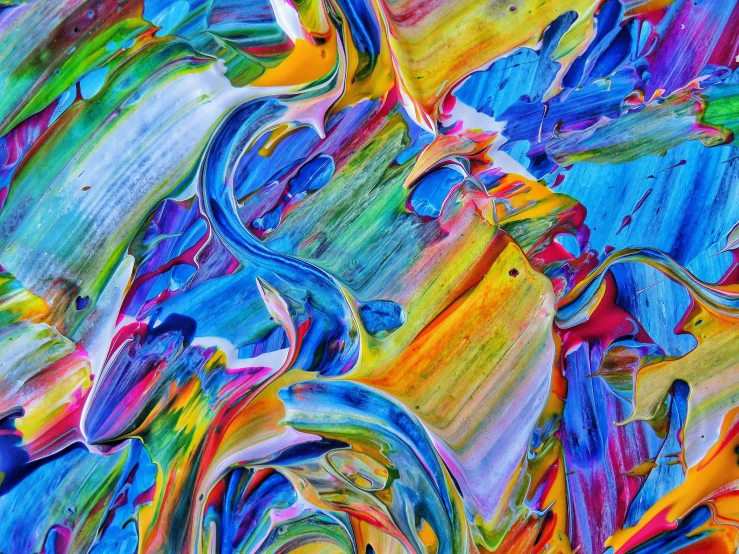 a close up of colorful paint on a piece of paper, inspired by Umberto Boccioni, trending on pexels, psychedelic lsd, colorful glass art, lsd waves, colorful plastic